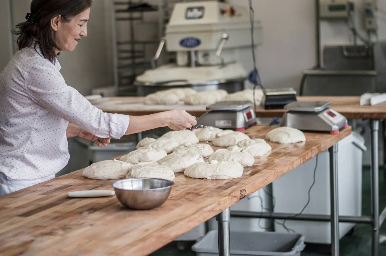 Shaping loaves on the bench