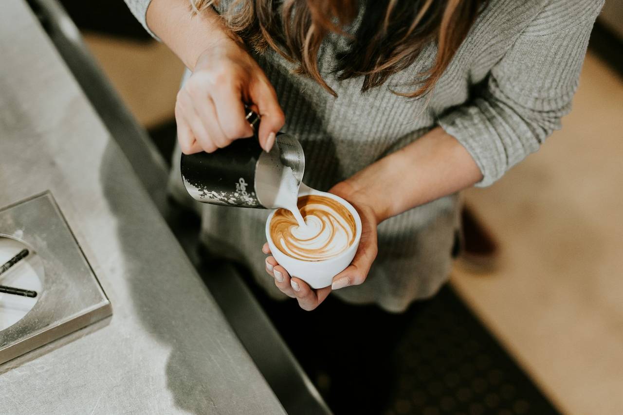 Barista pouring latte art